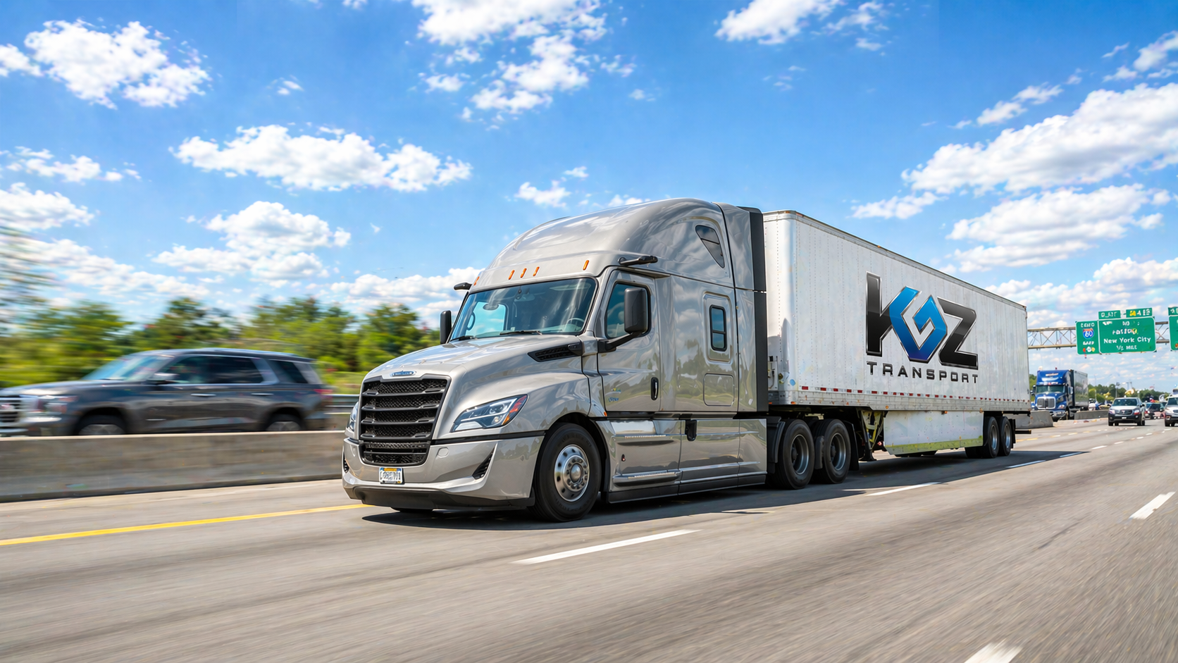 KGZ Transport Freightliner dry van semi-truck traveling on an interstate highway