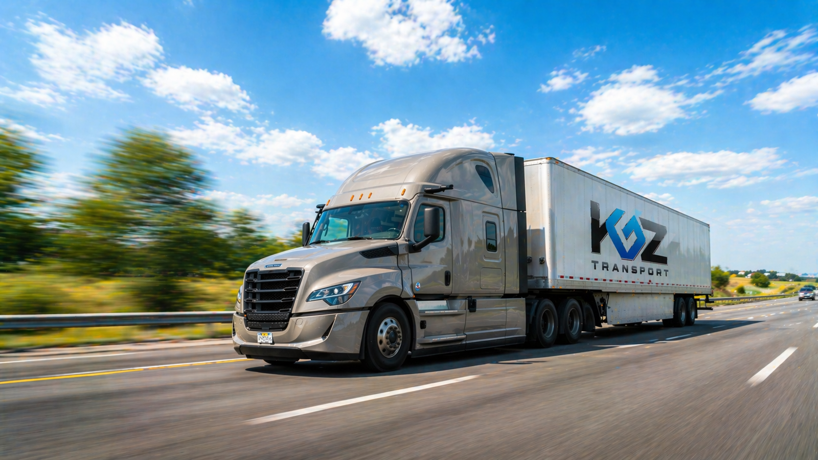 Silver KGZ Transport semi-truck moving on a highway under a blue sky