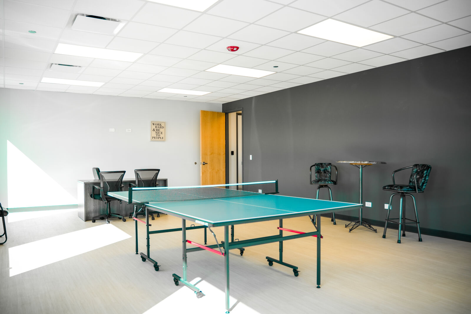 KGZ Transport break room featuring a ping pong table and comfortable seating area for employees